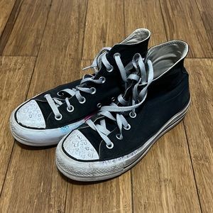 Old worn black hightop converse